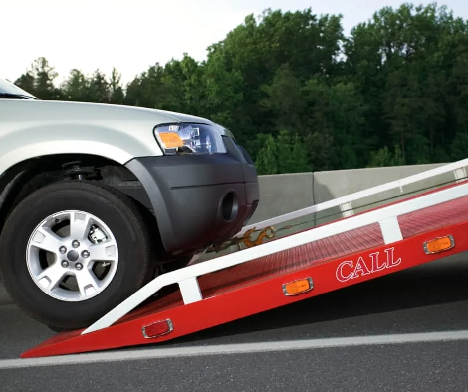 Mississauga tow truck loading a vehicle on a residential street